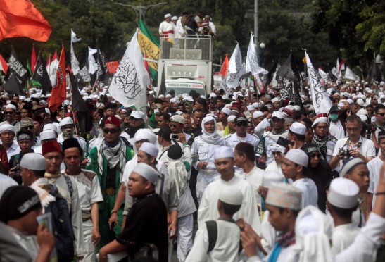 Indonesia hardline Muslim group members protest to call for maximum punishment to be imposed on Jakarta governor Basuki "Ahok" Tjahaja Purnama ahead of the verdict of a blasphemy trial in front of Supreme Court in Jakarta
